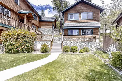 a house with a pathway in front of it at Lakefront Retreat in Bass Lake