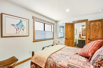 a bedroom with a bed and a window at 17th Tee Lake Tahoe Retreat in Incline Village