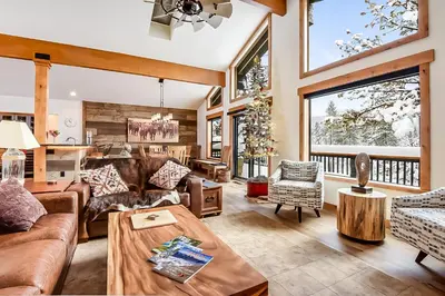 a living room filled with furniture and a large window at 17th Tee Lake Tahoe Retreat in Incline Village