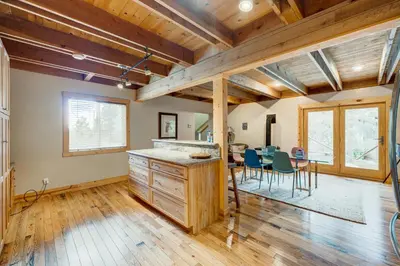 a kitchen and dining room with a table and chairs at Toast of the Mountain Town in Truckee