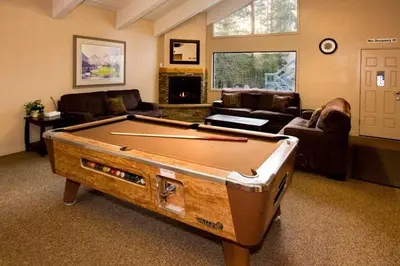 a living room with a pool table in it at St Anton Condos #49 condo in Mammoth Lakes