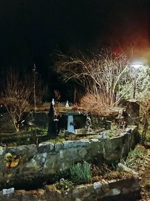 a garden with a cemetery at night with a street light at O'Brien's Oasis in Miramonte