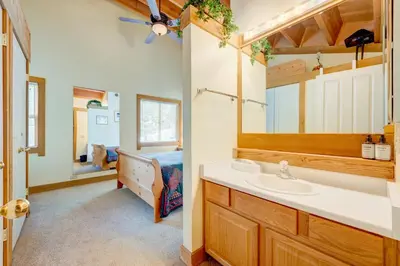 a bathroom with a sink and a mirror at Pine Time in Truckee