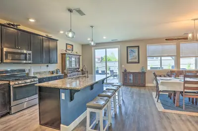 a kitchen with a large island with a counter top at Air Racing Decor, Hot Tub Sparks Home! in Sparks