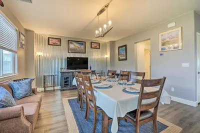 a dining room with a table and chairs at Air Racing Decor, Hot Tub Sparks Home! in Sparks