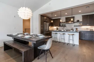 a kitchen with a large wooden table and chairs at Creekhouse 1334 in Mammoth Lakes