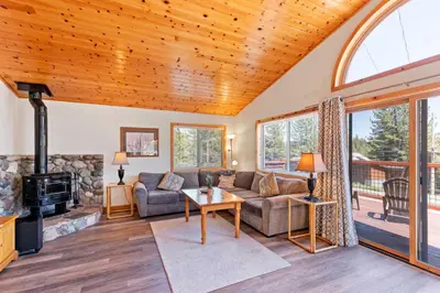 a living room with a couch and a fireplace at Less Than 8 Mi to Donner Lake Home with Deck and Balcony! in Truckee