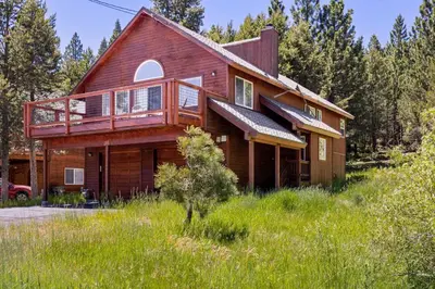 a large wooden house with a wrap around deck at Less Than 8 Mi to Donner Lake Home with Deck and Balcony! in Truckee