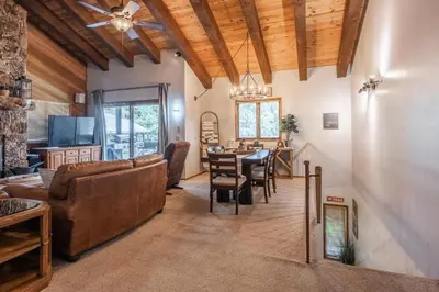 a living room with a couch and a table at Mammoth Pines #7 Newly updated 2 Bedroom plus Loft, 3 Full Bathrooms, Sleeps 8 people in Mammoth Lakes