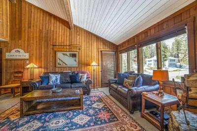 a living room with a couch and a table at Mountainback 100 in Mammoth Lakes