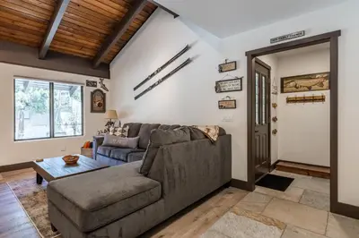 a living room with a couch and a table at Horizons IV #156 New Luxurious Listing! Fully Remodeled 2 Bedroom Plus Loft 3 Full Bathroom Sleeps 8 in Mammoth Lakes