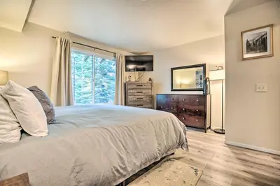 a bedroom with a bed and a window and a dresser at Elegant Mountain-View Condo Less Than 1 Mi to Lifts! in Mammoth Lakes