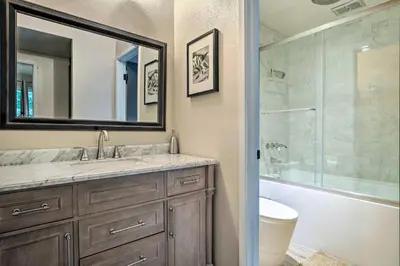 a bathroom with a sink and a mirror and a shower at Elegant Mountain-View Condo Less Than 1 Mi to Lifts! in Mammoth Lakes