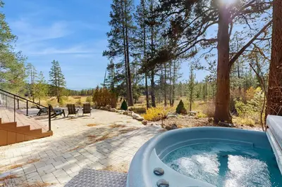 a jacuzzi tub in a yard with a patio at Bennett Flat Adventure in Truckee