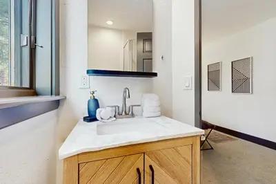a bathroom with a sink and a mirror at Bennett Flat Adventure in Truckee