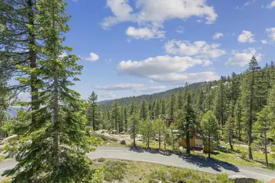 an aerial view of a house in a forest at Amazing Views - Modern Home - SH #14 in Bear Valley
