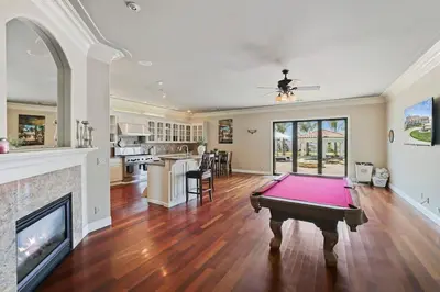a pool table in a living room with a fireplace at 4BR LUXURY ENTERTAINMENT OASIS in Tracy