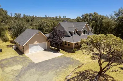 an aerial view of a house at Wooded Bliss in Mariposa