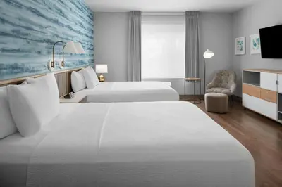 a hotel room with two beds and a tv at TownePlace Suites by Marriott Sacramento Rancho Cordova in Rancho Cordova