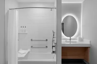 a white bathroom with a sink and a mirror at TownePlace Suites by Marriott Sacramento Rancho Cordova in Rancho Cordova
