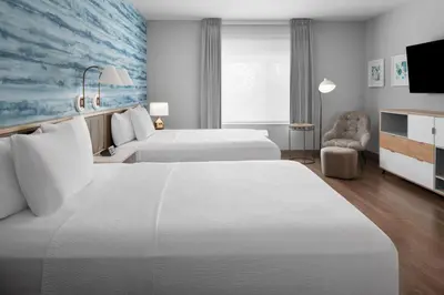 a hotel room with two beds and a tv at TownePlace Suites by Marriott Sacramento Rancho Cordova in Rancho Cordova