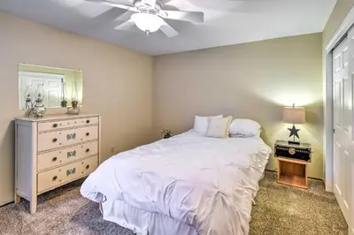 a bedroom with a bed and a ceiling fan at Near Fishing and Hiking Pioneer Cabin with Decks in Pioneer