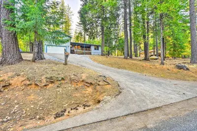 a road leading to a house in the woods at Near Fishing and Hiking Pioneer Cabin with Decks in Pioneer