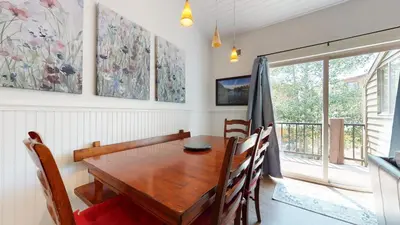 a dining room with a wooden table and chairs at Forest Creek #15 condo in Mammoth Lakes
