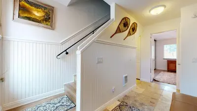 a staircase in a home with white walls at Forest Creek #15 condo in Mammoth Lakes