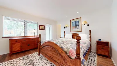 a bedroom with a bed and a dresser and a window at Forest Creek #15 condo in Mammoth Lakes