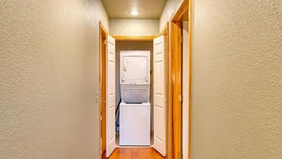 a hallway with an open refrigerator in a house at Golden Summit by AvantStay Stunning Secluded Cabin w Access to Tahoe Donner in Truckee
