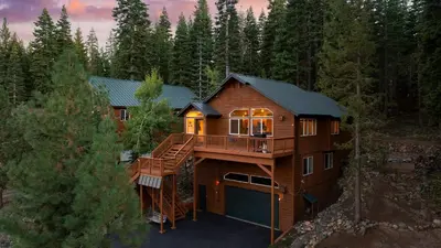an aerial view of a house with a deck at Golden Summit by AvantStay Stunning Secluded Cabin w Access to Tahoe Donner in Truckee
