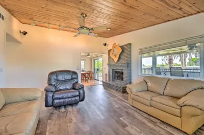 a living room with a couch and a chair at Waterfront Bethel Island Home with Dock and Slip in Bethel Island