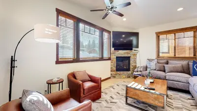 a living room with a couch and a fireplace at Lakeview Townhomes #5 townhouse in Mammoth Lakes