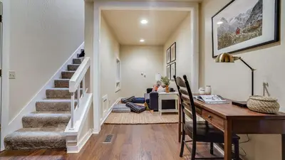 a home office with a desk and a staircase at Marillac by AvantStay Gorgeous Ski Cabin w Balcony Patio in Olympic Valley
