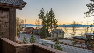 a balcony with a view of a street and a lake at Lakefront Home in Kings Beach w Views • Prime Location Atkinson by Avantstay in Tahoe Vista