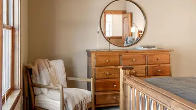 a bedroom with a dresser and a mirror at Lakefront Home in Kings Beach w Views • Prime Location Atkinson by Avantstay in Tahoe Vista