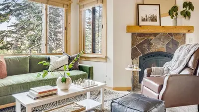 a living room with a couch and a fireplace at Ski-InSki-Out Access to Northstar Resort Near Truckee Sierra by AvantStay in Kingswood Estates