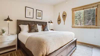 a bedroom with a large bed and a window at Ski-InSki-Out Access to Northstar Resort Near Truckee Sierra by AvantStay in Kingswood Estates