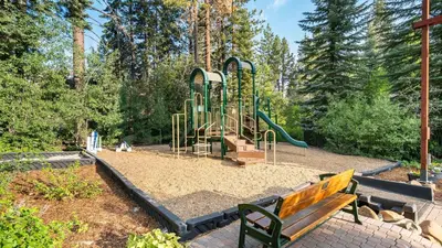 a park with a playground with a bench at Wolfe by AvantStay 5mins NorthStar Fireplace 2 Private Decks in Ponderosa Fairway Estates