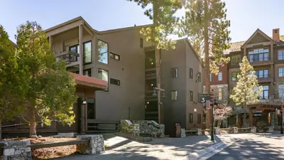 a building on a city street with trees at Flurry by AvantStay Tahoe Donner Home w Access to Northstar Resort Community in Kingswood Estates