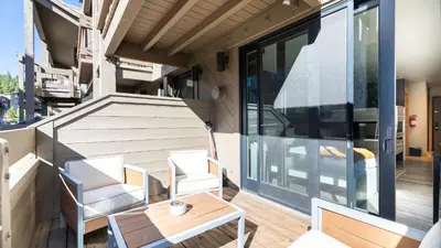 a tiny house with a balcony with a table and chairs at Flurry by AvantStay Tahoe Donner Home w Access to Northstar Resort Community in Kingswood Estates