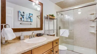 a bathroom with a sink and a shower at Pinegrove by AvantStay Beautiful Villas Condo just outside Tahoe City in Dollar Point
