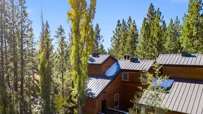 a house in the woods with trees at Pinegrove by AvantStay Beautiful Villas Condo just outside Tahoe City in Dollar Point