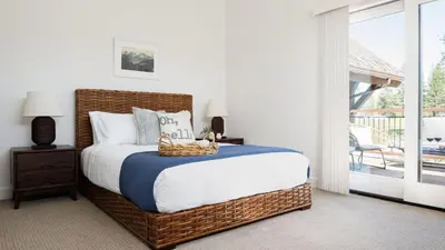 a bedroom with a large bed with a basket on it at Quartz by AvantStay Stunning Home In Truckee w Views in Ponderosa Fairway Estates