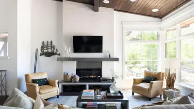 a living room with a couch and a fireplace at Quartz by AvantStay Stunning Home In Truckee w Views in Ponderosa Fairway Estates