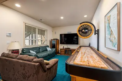 a living room with a large pool table in it at Lakefront Casa Cassaretto in Groveland