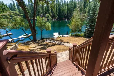 a deck with a view of a lake at Better at the Lake Home with Private Dock in Groveland