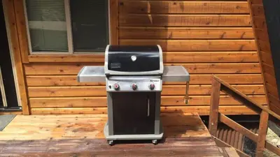 a grill sitting on top of a patio at Zephyr by AvantStay Stylish Modified A Frame w Access To Tahoe Donner in Truckee