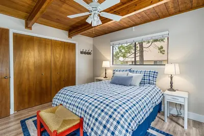 a bedroom with a bed and a ceiling fan at 3 Wild Turkeys Family Friendly Home in Groveland